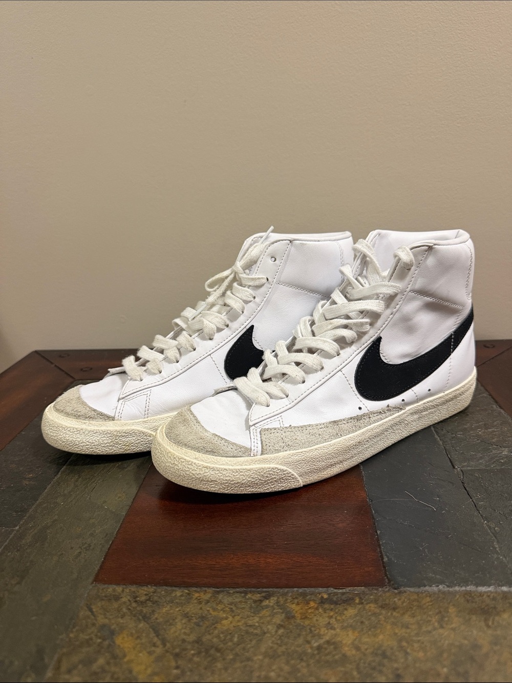 Nike White High-Top Sneakers with Black Swoosh